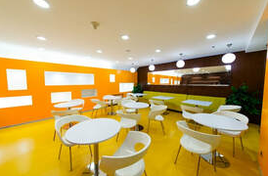 Cafeteria inside a factory in Victoriaville. The walls are brightly colored and the place is very luminous. Work executed by Peintre Victoriaville.